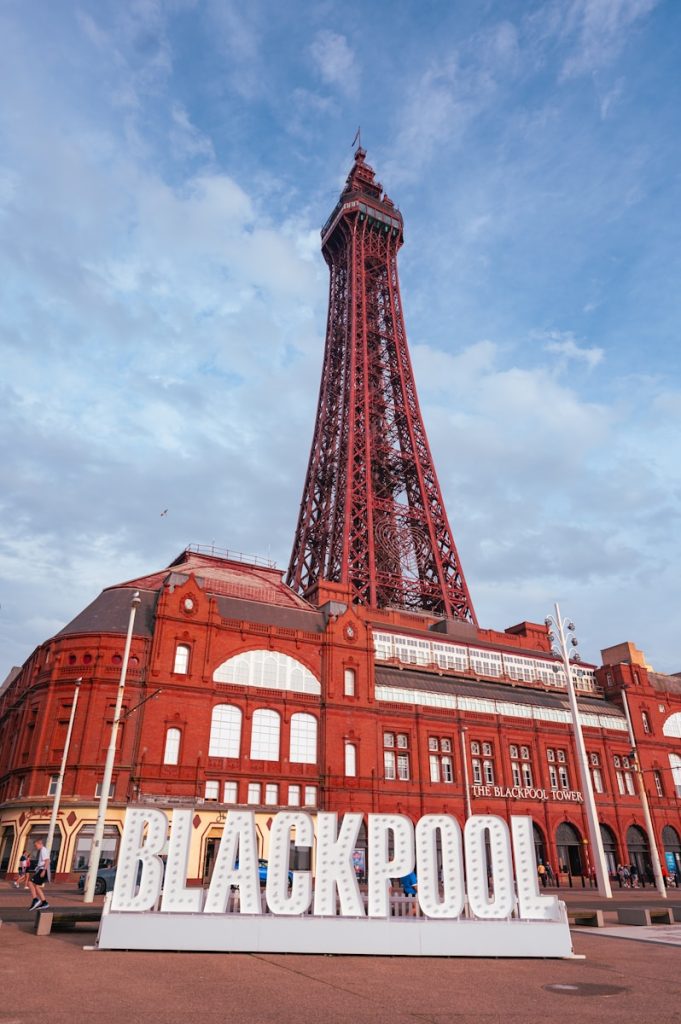 a very tall building with a very large sign in front of it