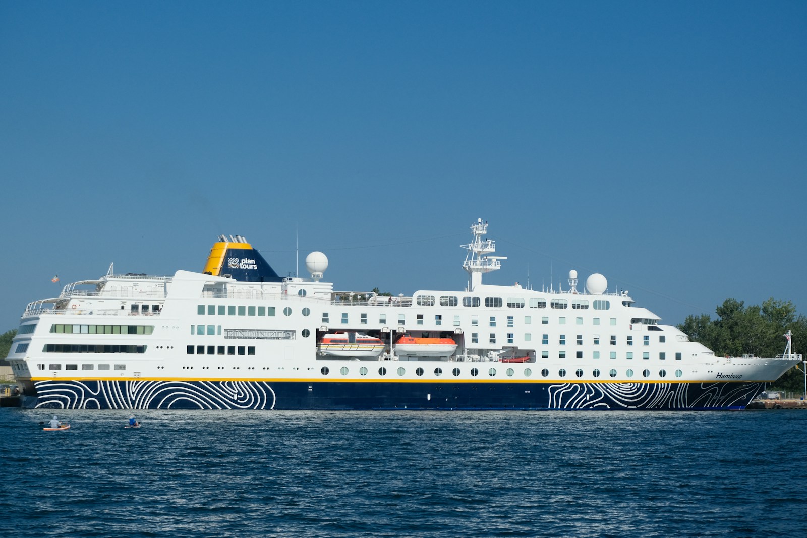 A large cruise ship in a body of water